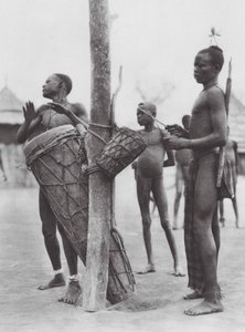 Africa: Moru men playing drums by Hugo Adolf Bernatzik