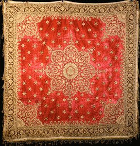 A Scarlet Velvet Floor Cover with Green Velvet Border, Densely Embroidered in Gilt Couched Gilt Thread by Indian School