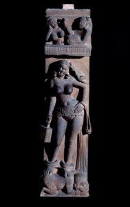 Representation of a Yakshini spirit of nature, holding a cage and a parrot, she stands on a dwarf. Sculpture by Mathura, sandstone, 2nd century by Indian School