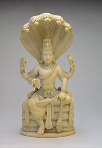 Vishnu, seated on the Serpent Sesha, holding a shell, mace, disc and lotus