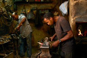 A blacksmith in the marketplace of Erfoud, Morocco (photo)