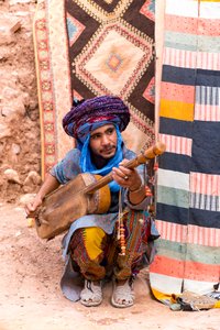 A local musician in the ksar of Ait Benhaddou in Morocco (photo)
