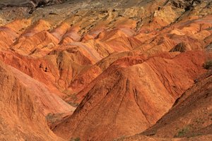 At the colored rocks near the campsite at Wu Cai Wan in the Gobi desert, Xinjiang..., 2007