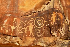 Near Vernal, UT at McKee Springs, Fremont petroglyphs showing warriors holding trophy heads., 2005