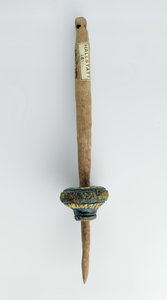 Spindle whorl with its surviving wooden spindle (from Hallstatt, Iron Age)