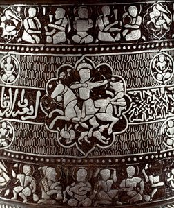 Islamic Art: Silver and copper candlestick with a rider