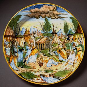Jews in the desert (or the recuperation of manna). God feeds Israelites who would starve from quail eggs and manna. Ceramic plate produced in Urbino in the workshop Fontana, Italy. Circa 1560. National Museum of Bargello, Florence, Italy