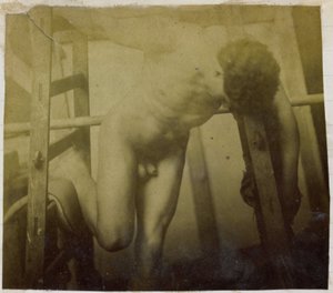 Study of a Male Nude Model, Leaning Forward in a Wooden Structure, in the Studio of Jacques de Lalaing