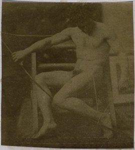 Study of a male nude model, sitting on a step, seen from the front with rope and bow on lap, in the studio of Jacques de Lalaing by Jacques Lalaing (attributed to)