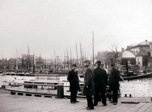 Men by a canal boat, Rotterdam
