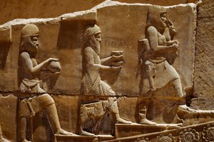 Relief sculpture of men carrying offerings on the walls of Persepolis. Persepolis, Iran. by James L Stanfield