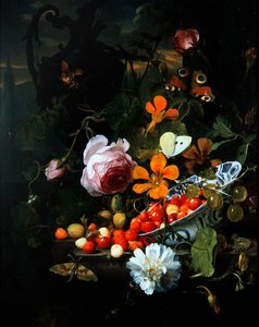 A still life of strawberries in a bowl and flowers