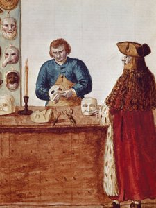 The masks shop of the Venice Carnival: a masked character comes to pick up a mask from the craftsman