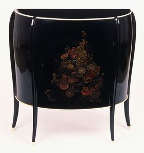 A bow-front chest of drawers