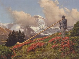 Switzerland: An Alphorn Blower, the Jungfrau in the background