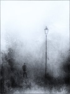 Lonely Figure Under Lamp by Jeffrey Hummel