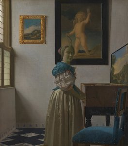 A Young Woman Standing at a Virginal