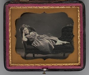Untitled portrait of a girl reclining on a chaise longue by John Adams Whipple