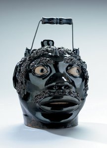 Brown-glazed and coleslaw-decorated face jug, Stine Pottery, White Cottage, Ohio by John Dollings