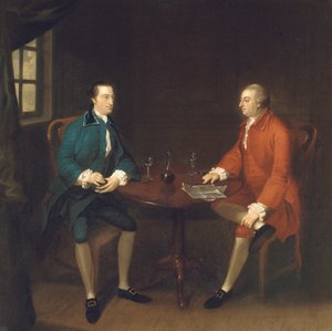 Two gentlemen seated at a table