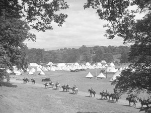 View of multiple cone-shaped tents, men in uniform on horseback (army?) by Joseph Hardman