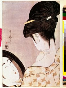 A woman powdering her neck with shade