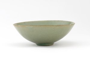 Bowl with molded design of fish among waves by Korean School