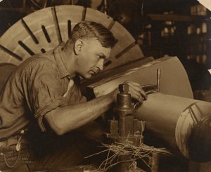 Man with Micrometer Measuring a Shaft to a Thousandth of an Inch by Lewis W. Hine