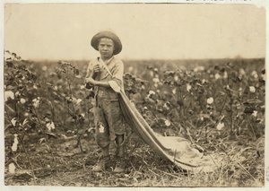 6-year old Warren Frakes with about 20 pounds of cotton in his bag at Comanche County, Oklahoma, 1916