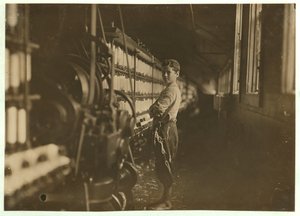 John Dempsey, 11 or 12 Years Old, Saturday Worker in the Mule-Spinning Room at Jackson Mill, Fiskeville, Rhode Island (1909)