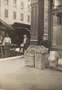 Lena Lochiavo, 11 years old, basket and pretzel seller, at Sixth Street market in front of saloon entrance, Cincinnati, Ohio, August 1908