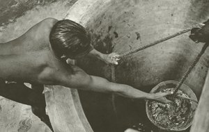 At the well by Lionel Wendt