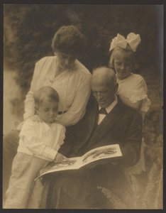Family Portrait with Picture Book by Louis Fleckenstein