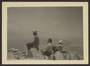 Hikers Seated on Rocks by Louis Fleckenstein
