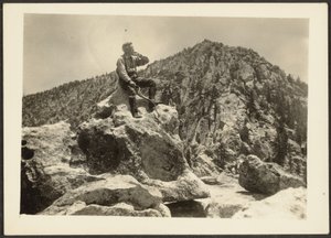 Man Seated on Rocks by Louis Fleckenstein