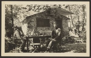 Outdoor Meal at Stone House in Woods by Louis Fleckenstein