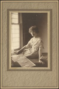 Portrait of a Woman Looking at Album by Louis Fleckenstein