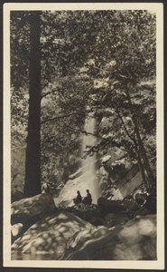 Two Figures by Waterfall in the Woods