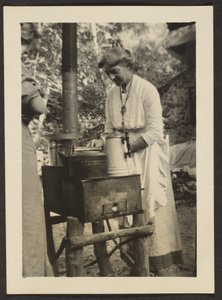 Woman Using Outdoor Stove by Louis Fleckenstein