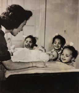 Nurse Henry Street Assists Three African-American Girls in Harlem, New York City by Luigi Leoni