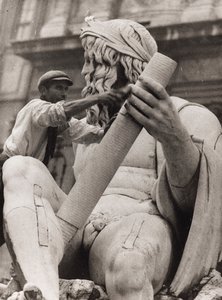Worker on the Sculpture of the Ganges in the Fountain of the Four Rivers in Piazza Navona in Rome by Luigi Leoni