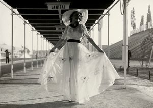 Model in a full summer dress created by the couture house Graldi