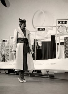 Model in an overcoat created by the couture house "Lamma"