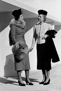 Two models present day-wear articles created by the couture house Fumach