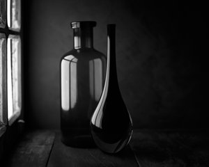 Elegant Bottles in Window Light by Luiz Laercio
