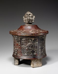 A Mayan lidded and carved tripod vessel, c.250-450