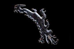 Eccentric flint depicting a crocodile canoe with passengers, c.A.D. 600?-900