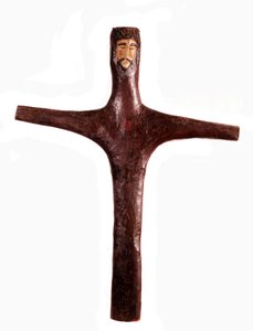 Mexican art: polychrome wooden cross with head of Christ carved from one piece. 17th century. Mexico. Michoacan Regional Museum