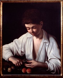 A Boy Peeling a Fruit