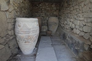 Minoan archaeological site of Phaistos. The magazine of the giant pithoi (storage jars). These jars are decorated with disc and rope patterns in relief. by Minoan
